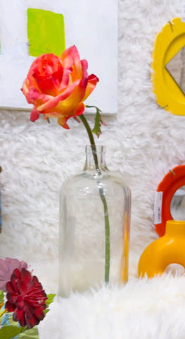 Vintage glass beverage bottle (flower not included)