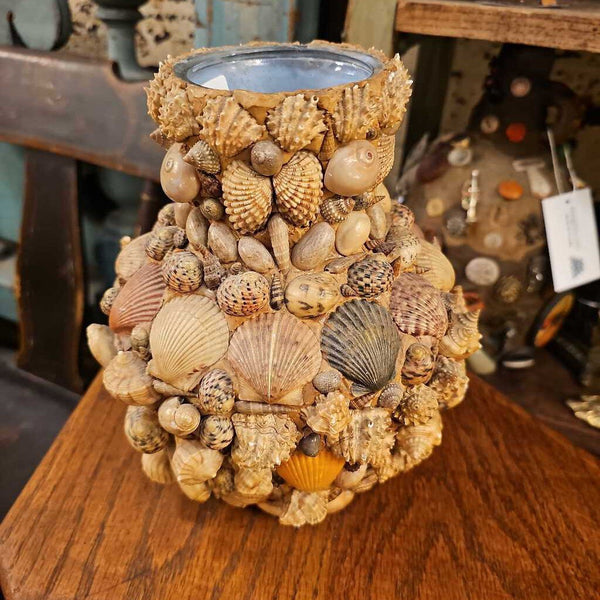 Shell memoryware on glass vase roundish