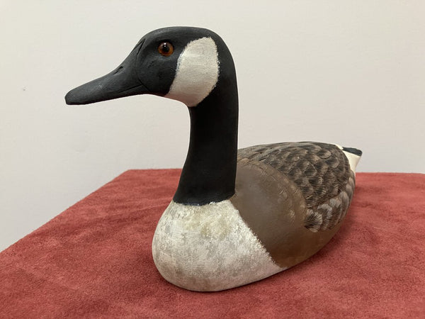 Carved wooden ducks, signed by artist