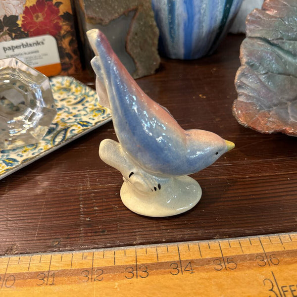 Vintage ceramic bird figurine each