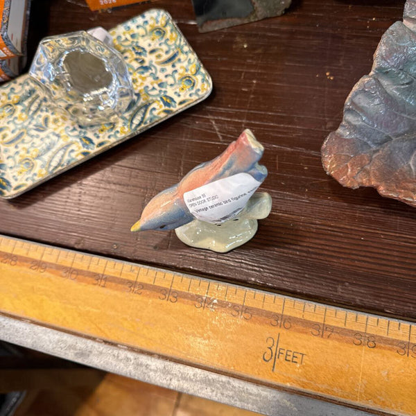 Vintage ceramic bird figurine each