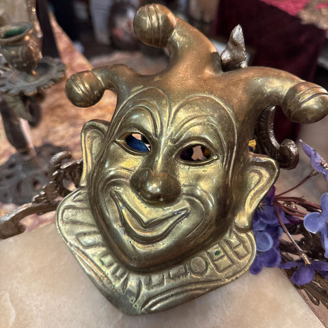Brass clown mask wall hanging