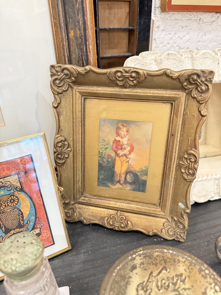 Small gold frame boy dog