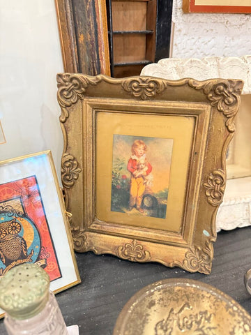 Small gold frame boy dog