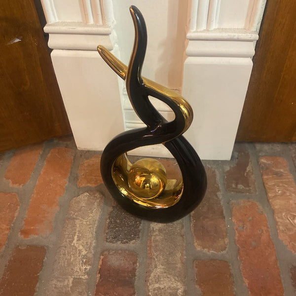 Black and gold MCM sculpture