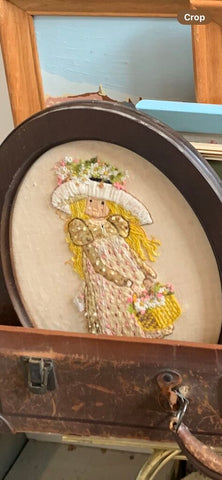 Vintage framed stitchery of girl with flowers