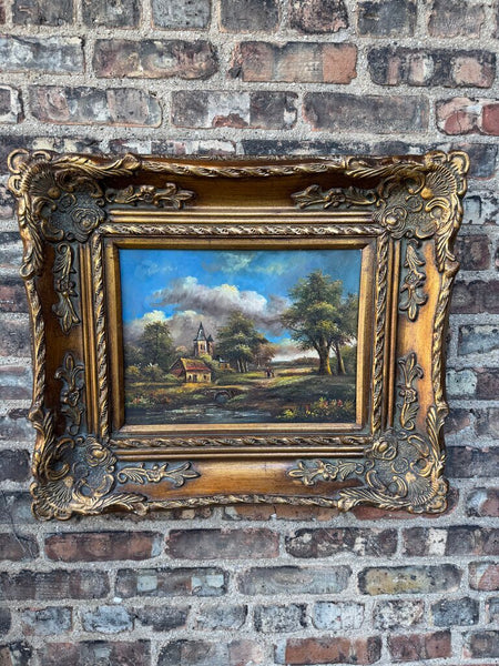 Vintage oil on board landscape in wood/plaster frame