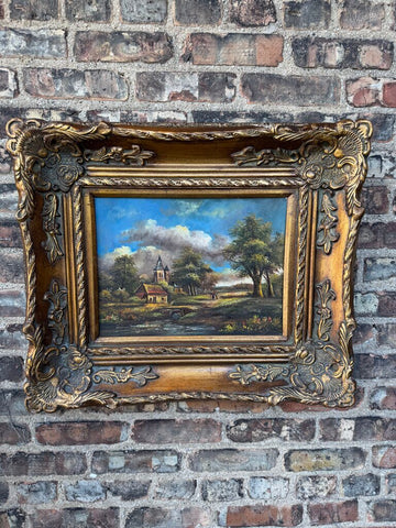 Vintage oil on board landscape in wood/plaster frame