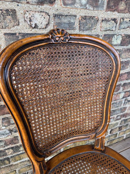 Wooden carved cane chair with bow detail