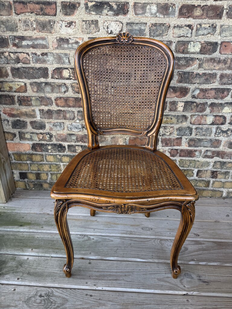 Wooden carved cane chair with bow detail
