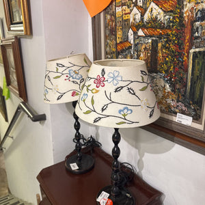 pair of black lamps with embroidered shades as is