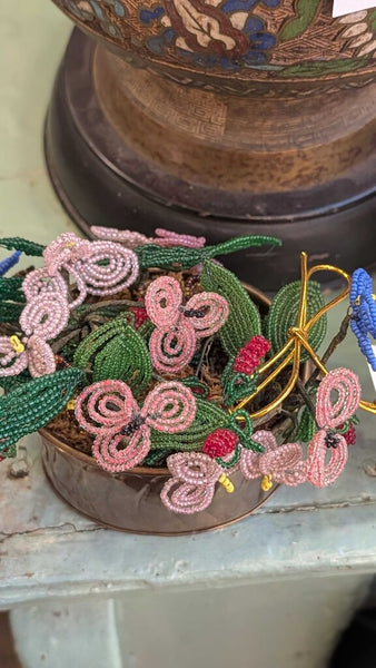 Beaded flower bouquet in brass container
