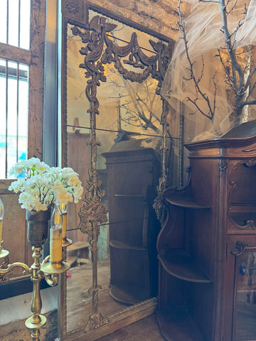 0313 Vintage weathered wall mirror with carved floral and bird motifs