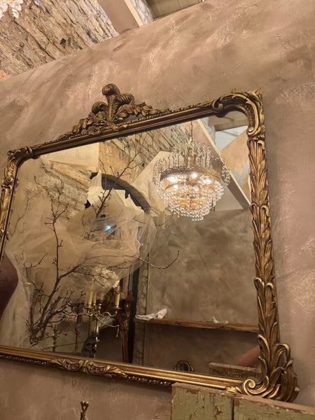 0317 Antique wood gilt wall mirror with fleur de lis top