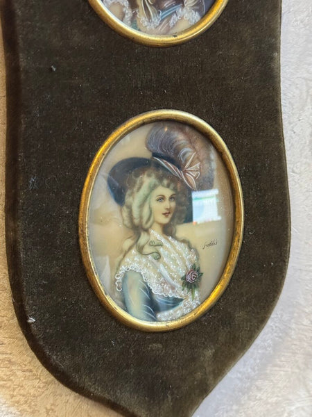 0557 2 Painted portraits in velvet frame