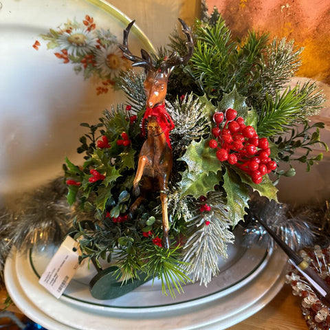 Vintage sleigh with reindeer and arrangement