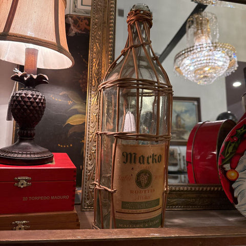 Tall vintage wine demijohn