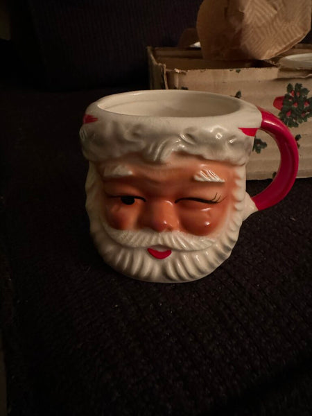 New in box old stock 2 winking Santa mugs and 2 regular Santa mugs. Original sticker Brinns Ceramics PA made in Japan with box