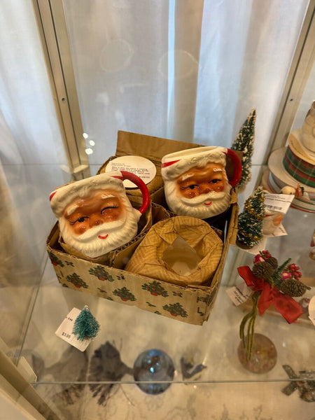 New in box old stock 2 winking Santa mugs and 2 regular Santa mugs. Original sticker Brinns Ceramics PA made in Japan with box