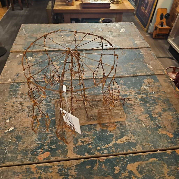 Folk art wire carnival swing