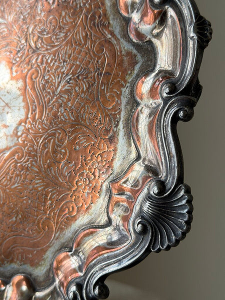 0955 English Silverplate over copper footed round tray