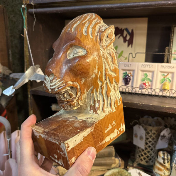 carved lion head bookends made in Spain
