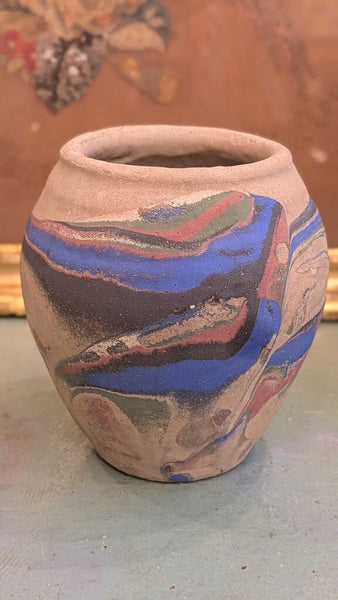 Tan with blue and pink Ozark roadside pottery approximately 7 inches
