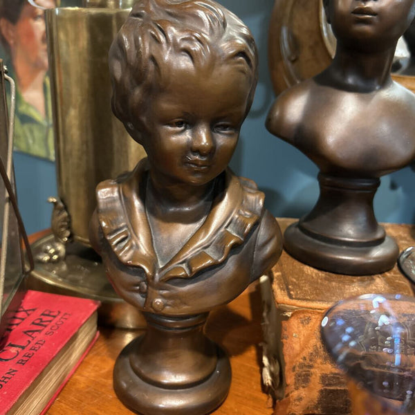 BRONZE PAINTED CHALKWARE CHILD BUSTS SET