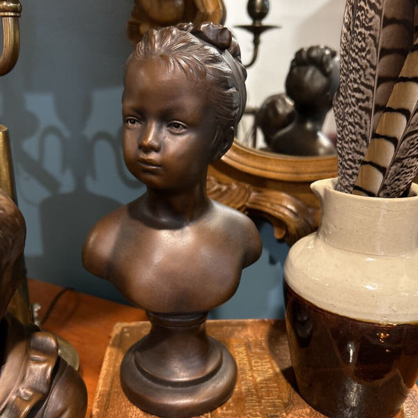 BRONZE PAINTED CHALKWARE CHILD BUSTS SET