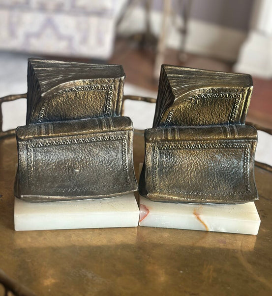 PAIR OF “BOOKISH” BOOKENDS ON MARBLE BASES. EACH BOOKEND IS 6"H x 5"W x 4"H