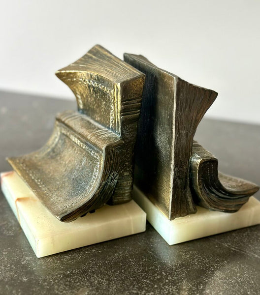 PAIR OF “BOOKISH” BOOKENDS ON MARBLE BASES. EACH BOOKEND IS 6"H x 5"W x 4"H