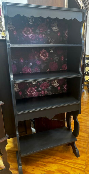 Black Bookcase with skull and roses wallpaper