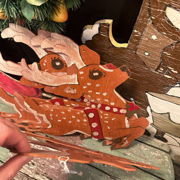 Wooden Santa and three reindeer cut out
